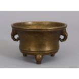 A CHINESE BRONZE TRIPOD CENSER, 19th Century or earlier, weighing approx. 710gm, the base cast