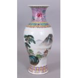 A 20TH CENTURY CHINESE FAMILLE ROSE PORCELAIN VASE, painted with a river landscape scene, the base