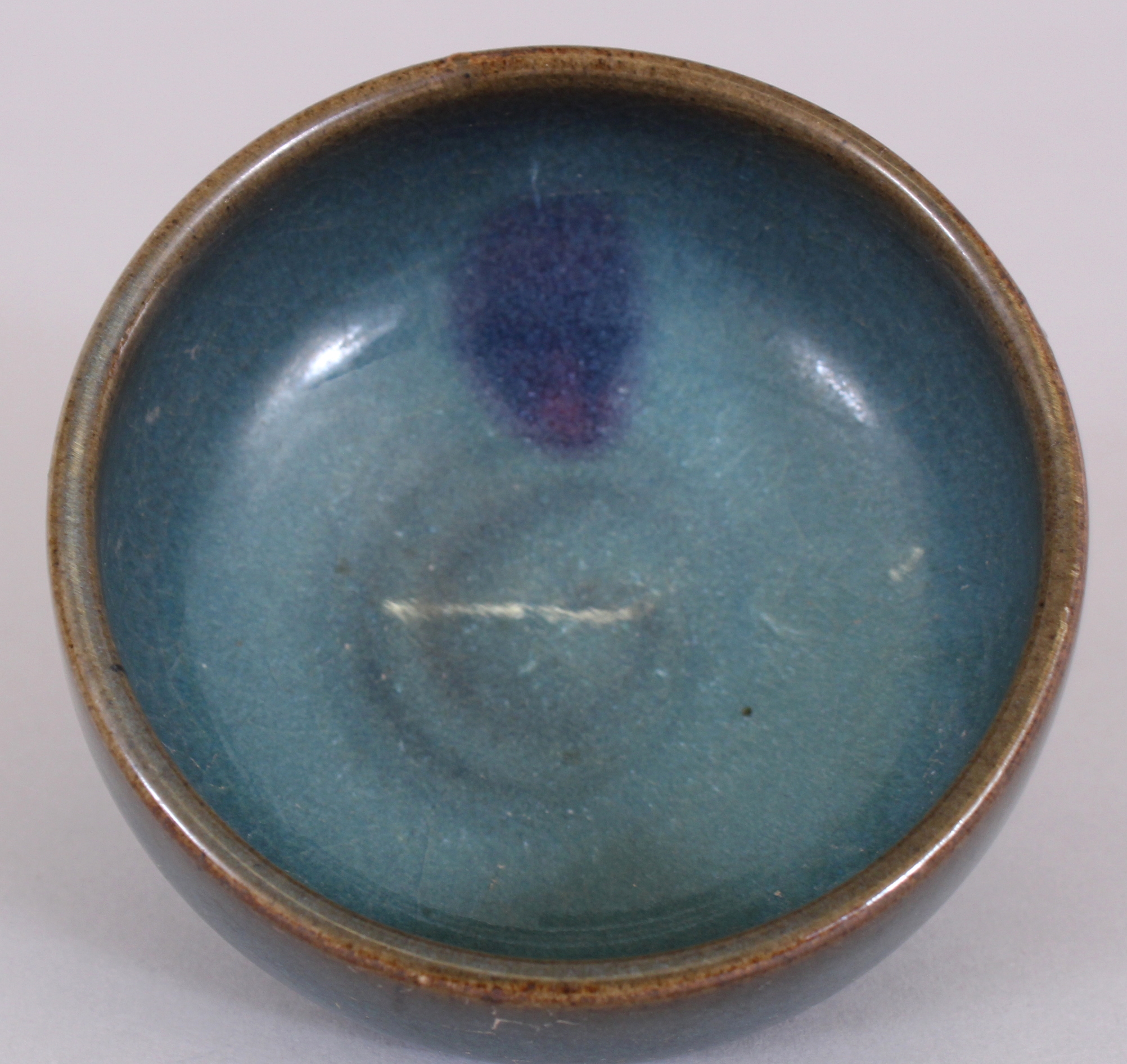 A CHINESE JUN WARE PURPLE SPLASH STONEWARE TEA BOWL, possibly Ming Dynasty, the unglazed base with - Image 3 of 5