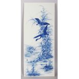 A CHINESE BLUE & WHITE RECTANGULAR PORCELAIN PLAQUE, decorated with water fowl in flight above a