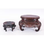 A GOOD QUALITY 19TH CENTURY CHINESE OVAL HARDWOOD STAND, on scroll feet, the frieze carved and