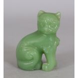 A 20TH CENTURY CHINESE GREEN GLASS MODEL OF A CAT, 2.75in high.