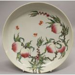 A CHINESE FAMILLE ROSE PORCELAIN SAUCER DISH, the interior decorated with bats above a stem of peach