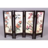 A SMALL CHINESE FOUR-FOLD WOOD FRAMED TABLE SCREEN, with painted stone landscape panels, each fold