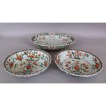 A PAIR OF CHINESE KANGXI PERIOD FAMILLE VERTE FLUTED PORCELAIN BOWLS, circa 1700, each painted