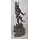 A 19TH CENTURY INDIAN TWO-SECTION BRONZE FIGURE OF MULTI-ARMED SHIVA, dancing on a prostrate