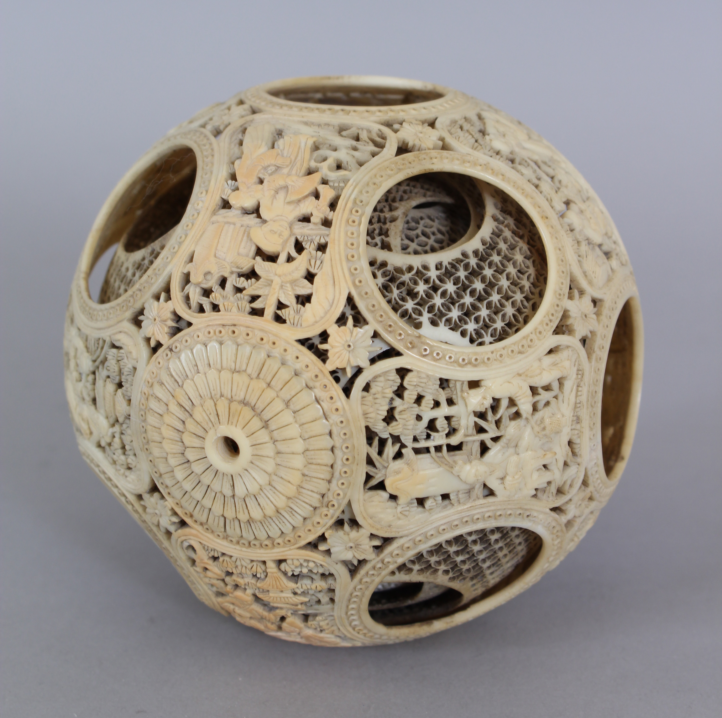 A SLIGHTLY SMALLER 19TH CENTURY CHINESE CARVED IVORY CONCENTRIC BALL, weighing approx. 177gm, the