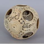 A SLIGHTLY SMALLER 19TH CENTURY CHINESE CARVED IVORY CONCENTRIC BALL, weighing approx. 177gm, the