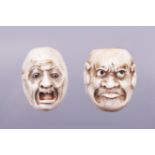 TWO SMALL JAPANESE MEIJI PERIOD IVORY NOH MASK CARVINGS, each 0.75in high. (2)