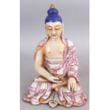 A CHINESE PORCELAIN FIGURE OF BUDDHA, the seated figure decorated in puce and blue enamels and in