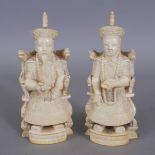 A PAIR OF EARLY 20TH CENTURY CHINESE CARVED IVORY FIGURES OF AN EMPEROR & AN EMPRESS, weighing in