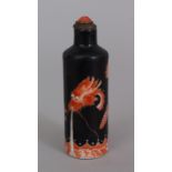 A GOOD 19TH CENTURY CHINESE BLACK GROUND IRON-RED DECORATED PORCELAIN SNUFF BOTTLE & CORAL