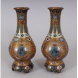 AN EARLY 20TH CENTURY PAIR OF GOOD QUALITY CHINESE CLOISONNE VASES, 6.5in high.