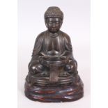 AN EARLY 20TH CENTURY JAPANESE BRONZE FIGURE OF SEATED BUDDHA, together with a fixed wood stand, 7.