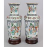 A PAIR OF 19TH CENTURY CHINESE FAMILLE VERTE PORCELAIN VASES, together with fixed wood stands, 10.