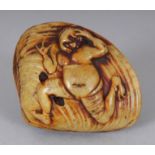 A JAPANESE STAINED IVORY-STYLE SHELL FORM NETSUKE, 2in wide.