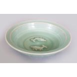 A CHINESE SONG/YUAN STYLE LONGQUAN CELADON DISH, the interior centre moulded with twin fish, 7.