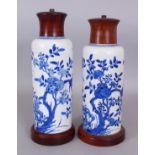 A PAIR OF CHINESE KANGXI PERIOD BLUE & WHITE PORCELAIN VASES, mounted as lamps with fitted wood