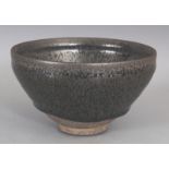 A CHINESE SONG STYLE JUN WARE OIL SPOT CERAMIC TEA BOWL, the glaze falling well short of the foot,