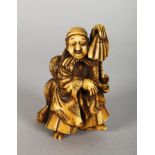 A JAPANESE MEIJI PERIOD STAINED IVORY NETSUKE OF A DANCER & HIS SON, the man holding an upturned