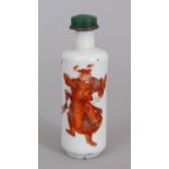 A 19TH CENTURY CHINESE IRON-RED DECORATED PORCELAIN SNUFF BOTTLE & GREEN HARDSTONE STOPPER, the side