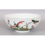 A CHINESE FAMILLE ROSE FLUTED PORCELAIN BOWL, the sides decorated with butterflies and foliage,