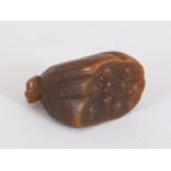 AN UNUSUAL SMALL CHINESE SOAPSTONE MODEL OF A LOTUS POD, 1.5in long.