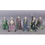 A SET OF SIX GOOD QUALITY 19TH CENTURY CHINESE FAMILLE ROSE PORCELAIN FIGURES OF IMMORTALS, each
