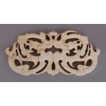 A CHINESE WHITE STONE PENDANT, in the form of a mirror pair of archaic dragons, 3.75in wide & 1.75in