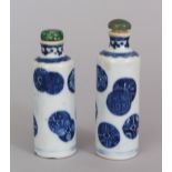 A GOOD PAIR OF 19TH CENTURY CHINESE BLUE & WHITE PORCELAIN SNUFF BOTTLES & GREEN HARDSTONE STOPPERS,