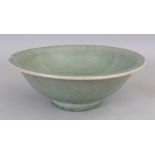 AN 18TH/19TH CENTURY CHINESE CELADON CRACKLEGLAZE PORCELAIN BOWL, with a flared rim, 10.5in diameter