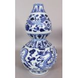 A LARGE YUAN STYLE BLUE & WHITE DOUBLE GOURD DRAGON & PHOENIX PORCELAIN VASE, the base unglazed,