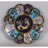 A JAPANESE MEIJI PERIOD CLOISONNE DISH, with a lobed rim, decorated with panels of phoenix, dragon