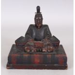 A SIMILAR JAPANESE LACQUERED WOOD MODEL OF A SAMURAI, , seated in meditation on a rectangular