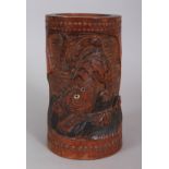 AN EARLY 20TH CENTURY ORIENTAL CARVED BAMBOO BRUSHPOT, possibly Korean, carved in deep relief with a