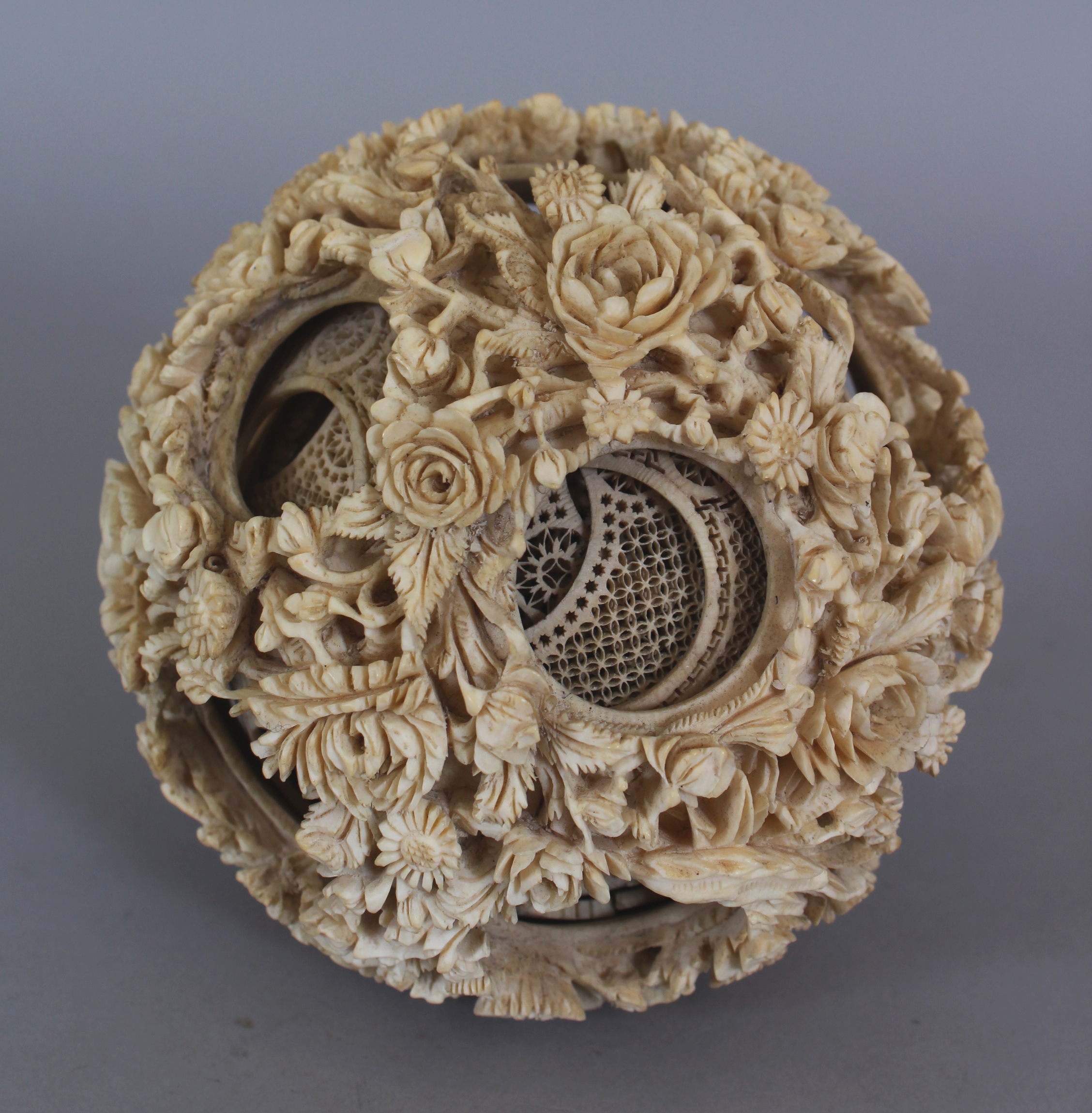 A LARGE 19TH CENTURY CHINESE CARVED IVORY CONCENTRIC BALL, weighing approx. 377gm, the outer - Image 2 of 6