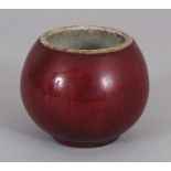 A SMALL 18TH/19TH CENTURY CHINESE SANG-DE-BOEUF PORCELAIN WATER POT, the sides applied with a