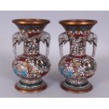 A PAIR OF JAPANESE MEIJI PERIOD WHITE GROUND CLOISONNE VASES, of archaic form, the neck with