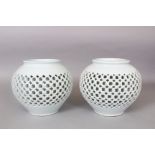 AN UNUSUAL PAIR OF 20TH CENTURY KOREAN WHITE GLAZED RETICULATED VASES, 8.4in wide at widest