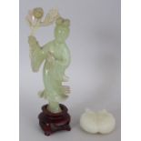 A 20TH CENTURY CHINESE CELADON BOWENITE FIGURE OF GUANYIN BEARING A FLORAL SPRAY, together with a