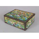 AN EARLY 20TH CENTURY CHINESE ENAMELLED METAL RECTANGULAR BOX, the hinged cover decorated in