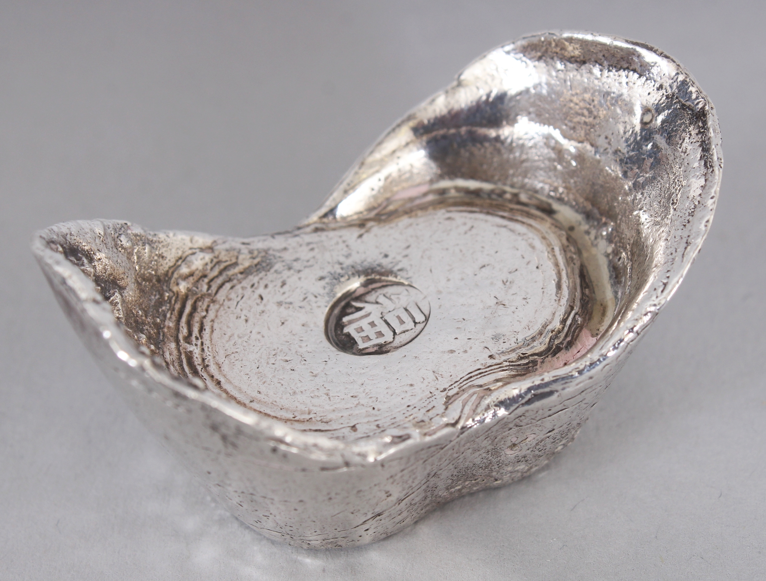 TWO 20TH CENTURY CHINESE SILVER METAL INGOTS, weighing approx. 110gm & 73gm, each interior with an - Image 2 of 7