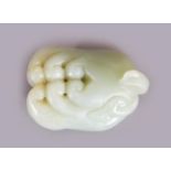 A CHINESE CELADON JADE BUDDHA'S HAND MODEL OF A FINGER CITRON, 2.25in long.