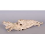 A GOOD JAPANESE MEIJI PERIOD IVORY OKIMONO OF A LION ATTACKING A CROCODILE, the eyes of the