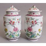 A GOOD MIRROR PAIR OF CHINESE REPUBLIC PERIOD FAMILLE ROSE PORCELAIN VASES & COVERS, each painted