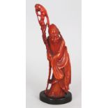 A SMALLER SIMILAR EARLY 20TH CENTURY CHINESE HORN CARVING OF SHOU LAO, together with a fixed wood