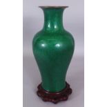 A 19TH/20TH CENTURY CHINESE APPLE GREEN CRACKLEGLAZE PORCELAIN VASE, together with a fitted wood