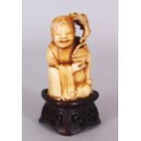 A SMALL GOOD QUALITY 19TH CENTURY CHINESE CARVED IVORY FIGURE OF A KNEELING BOY DEITY, together with