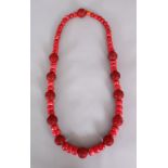 A GOOD 20TH CENTURY CHINESE CINNABAR LACQUER & RED CORAL NECKLACE, of larger than average size,