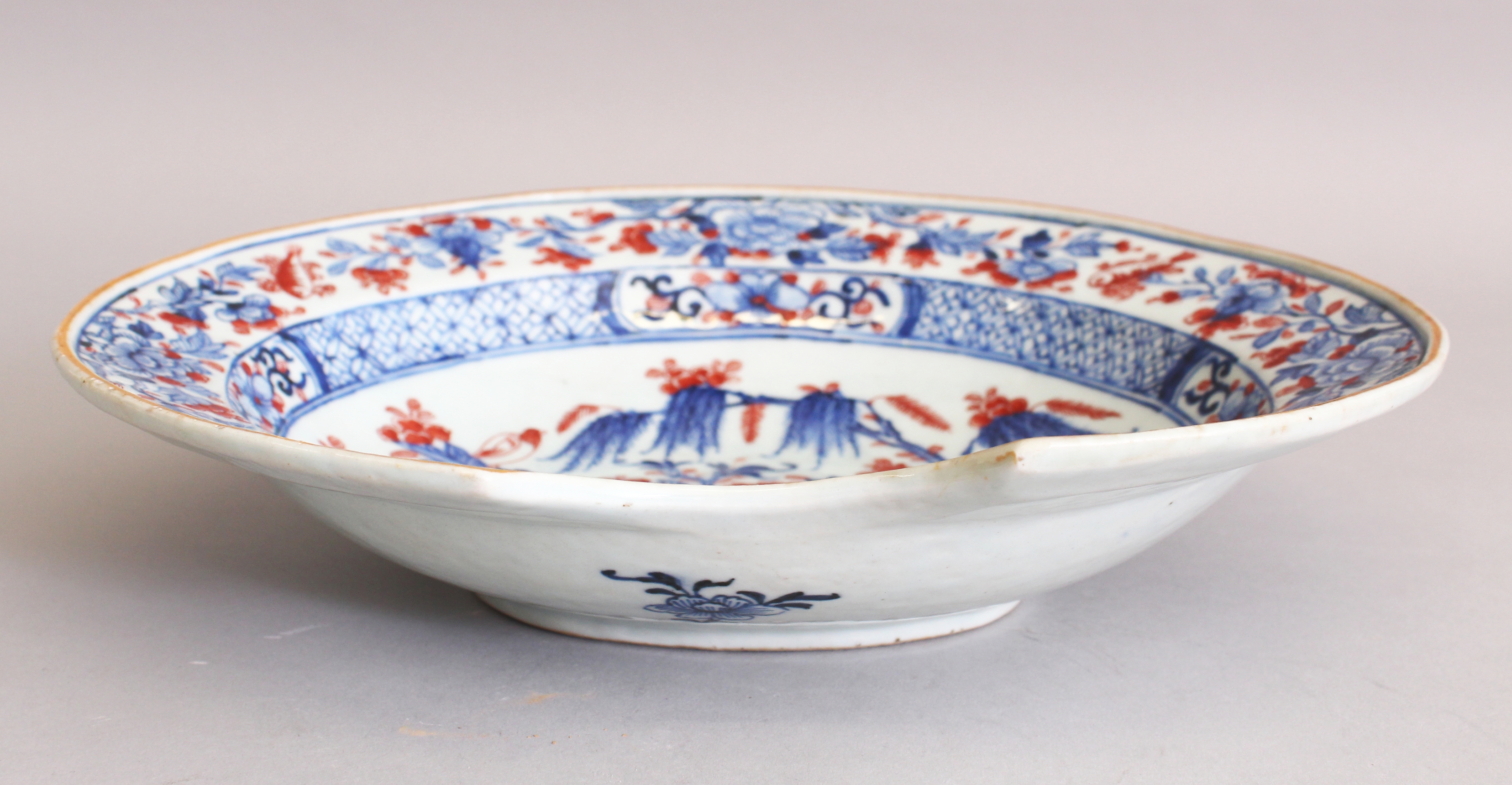 AN 18TH CENTURY CHINESE QIANLONG PERIOD UNDERGLAZE-BLUE & IRON-RED PORCELAIN BARBERS BOWL, the - Image 3 of 4